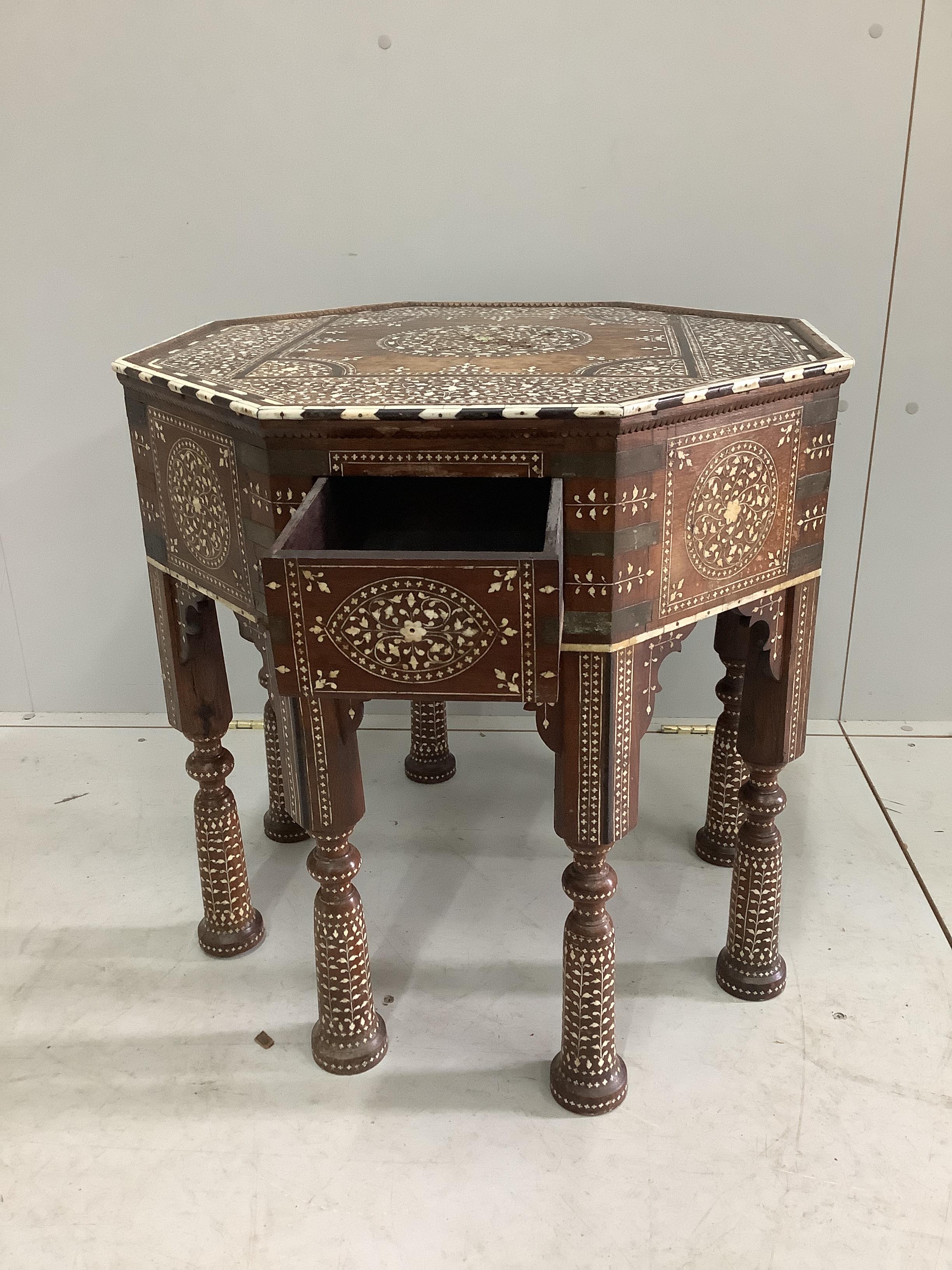 A 19th century Indian Hoshiarpur brass mounted octagonal bone inlaid table, fitted two drawers on turned legs, width 62cm, height 62cm